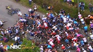 Fan with sign causes huge pileup in Stage 1 of the Tour de France  Cycling on NBCSports [upl. by Otila397]